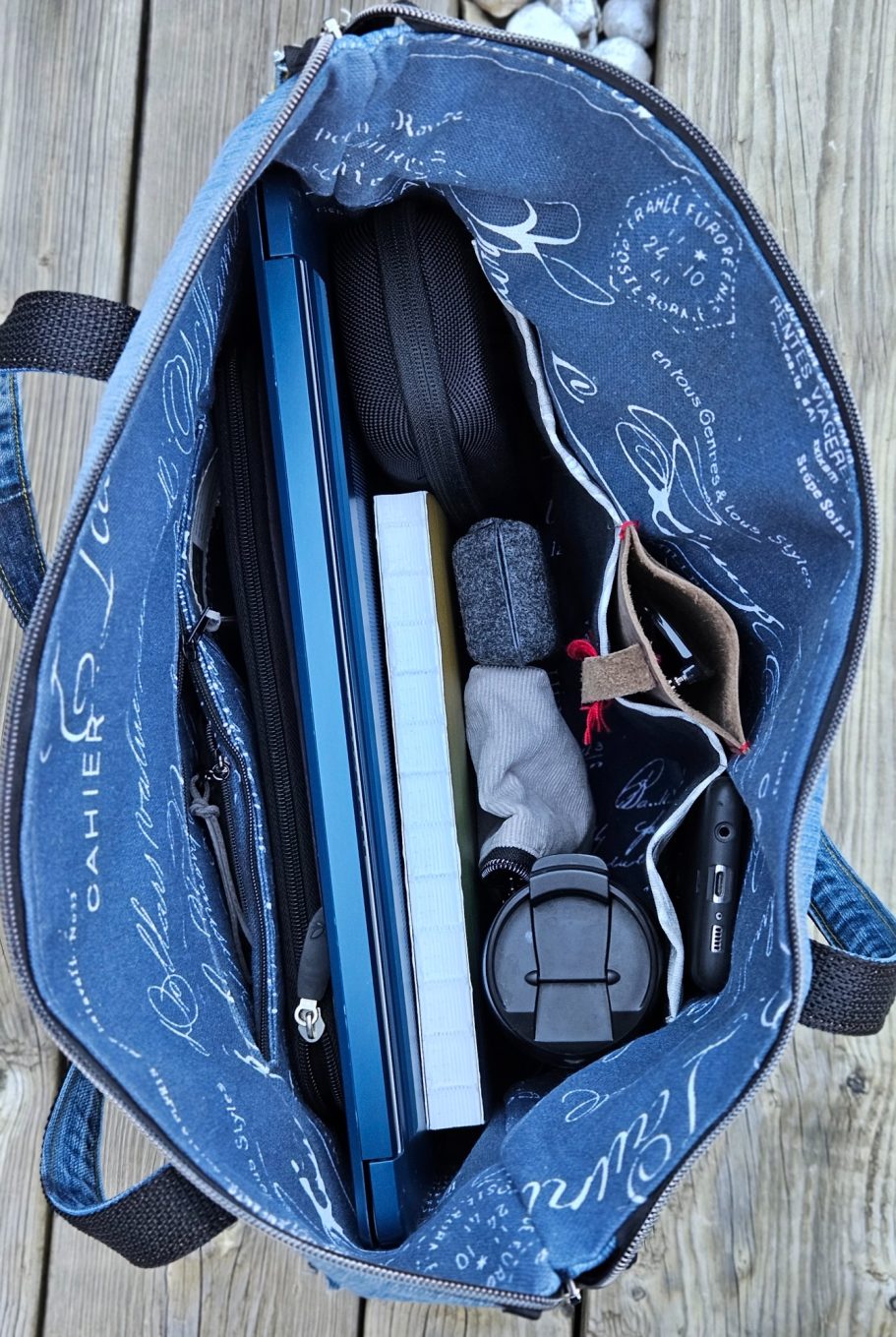 Denim Bag Interior with Zip Pocket Close up of a denim bag interior with zip pocket, dark lining and handmade finishing details.