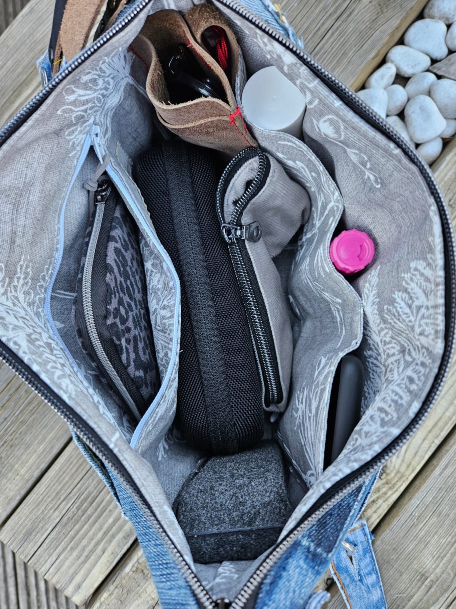 Inside the Handmade Denim Bag Inside of a handmade denim bag showing dark lining, open pockets and practical organisation for everyday use.