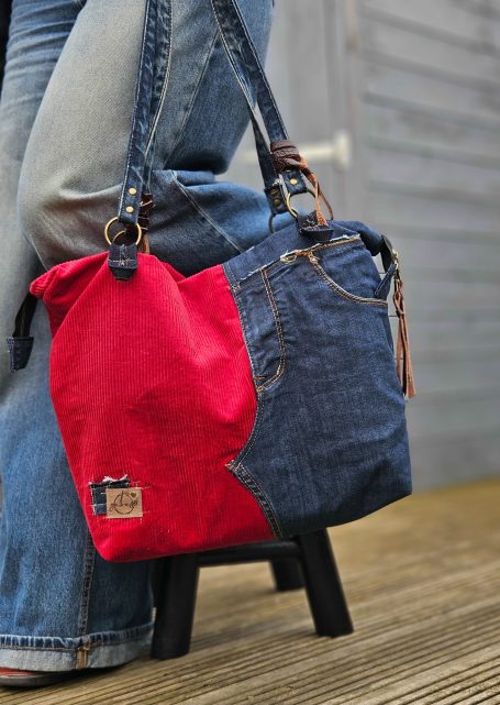 Red corduroy and denim tote bag with shoulder straps, double zip closure and structured shape