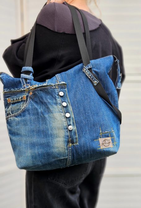 Blue denim tote bag with patchwork front, double zip top and practical outer pockets