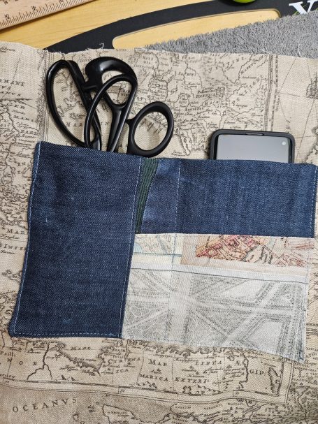 Finished denim bag lining with organised inside pockets, designed to help keep everyday essentials easy to find.