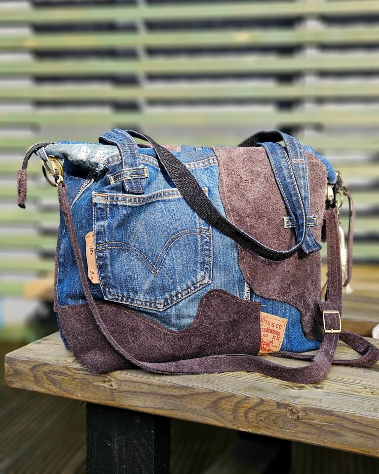 Stylish patchwork bag made from denim and suede in various shades.
